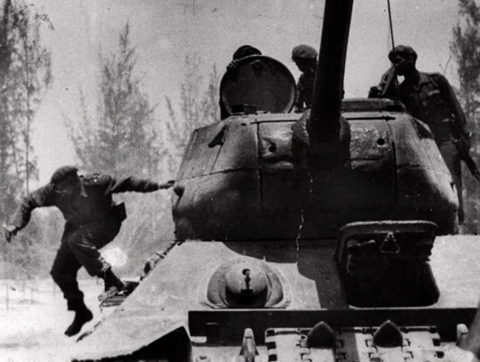 In this April 1961 file photo, Cuba's leader Fidel Castro jumps from a tank as he arrives at Giron, Cuba, near the Bay Of Pigs. On April 17-19, 1961, the beach was the stage for one of the most memorable chapters in the struggle between Washington and Havana: the invasion of Cuba by a CIA-trained band of armed exiles. (Bohemia Magazine/AP)